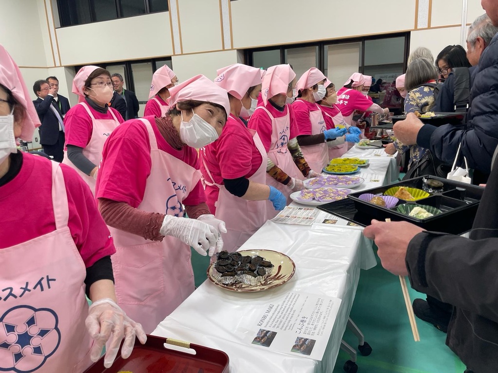 local people serving food