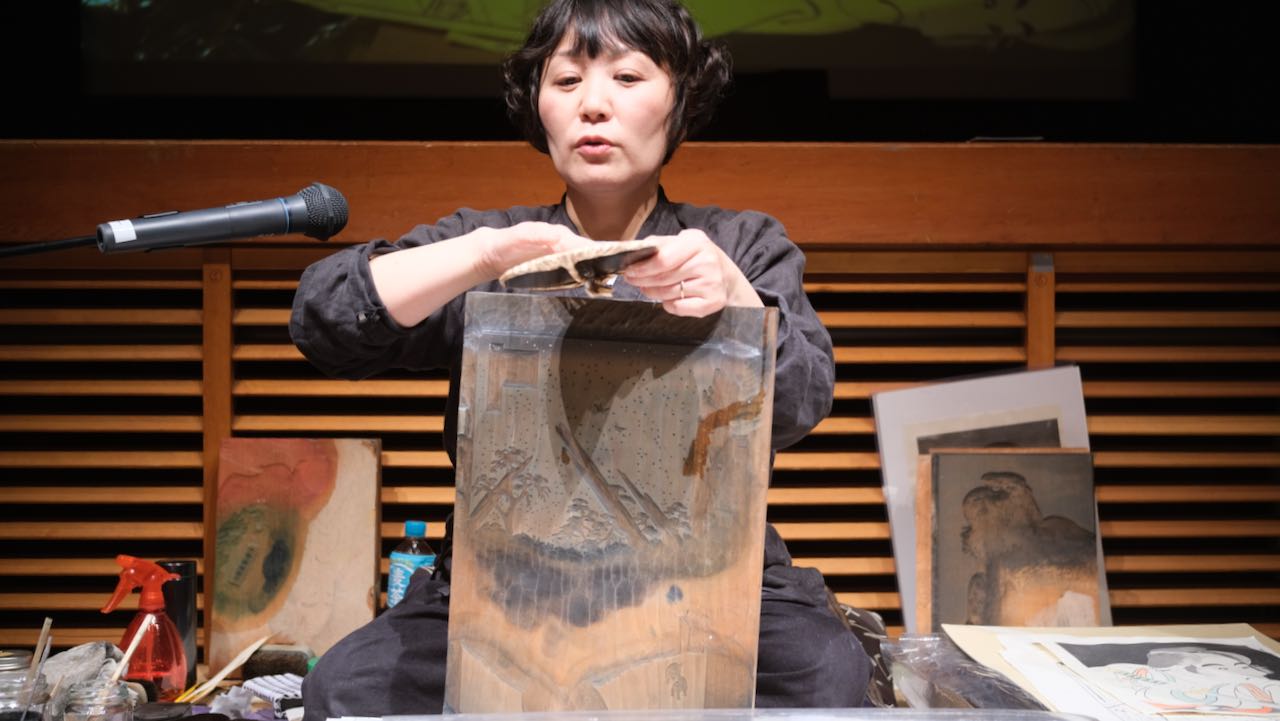 sensei showing woodblock