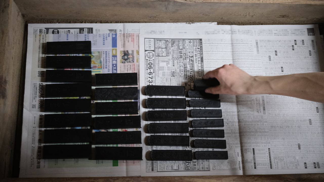 sorting sticks in wooden box